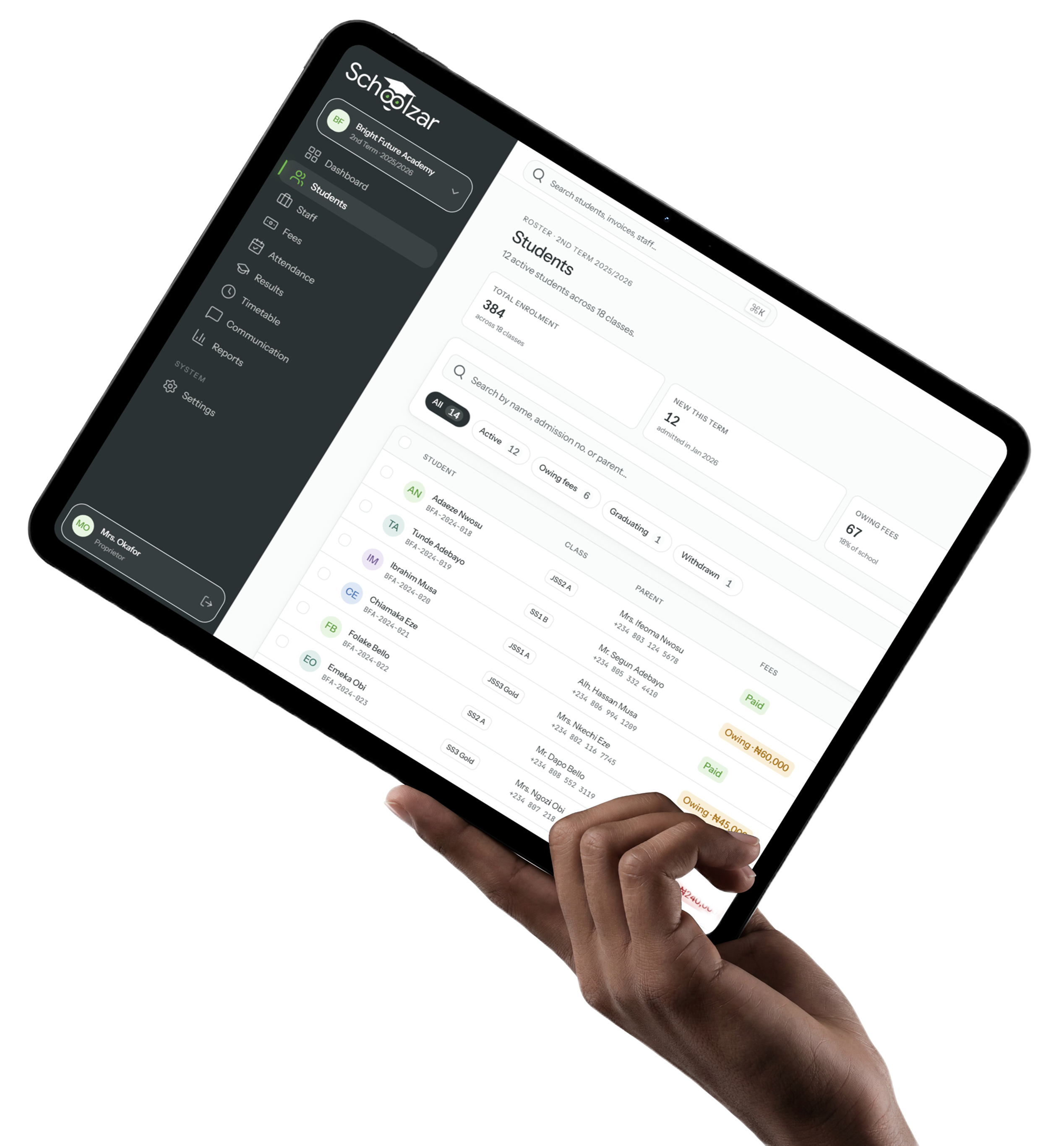 A hand holding a tablet showing the Schoolzar student roster — 384 enrolled across 18 classes, with class, parent and fee status per student